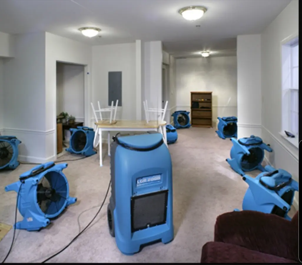 Air movers and dehumidifier setup for Water Damage Restoration in Swansea